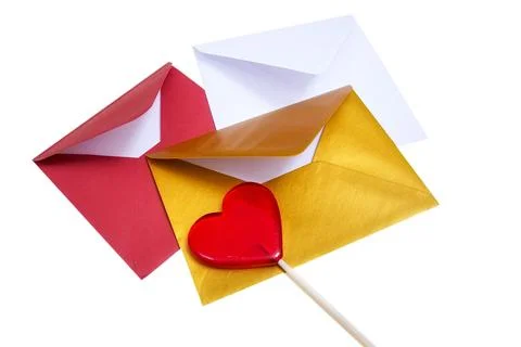 Group of open multicolored envelopes with red lollipop in the shape of a he.. Foto stock
