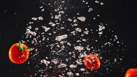 Group of organic fresh red tomatoes in water splash on black background Vídeo Stock 293083802
