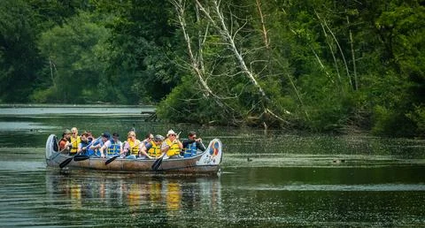 Group paddling down the Long Pond at the Toronto Islands. Tourists paddling.. Stock Photos