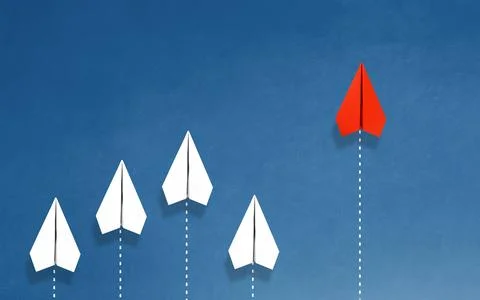 Group of paper plane in one direction and with one individual pointing in t.. Stock Photos