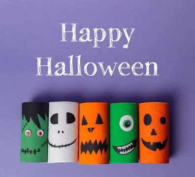A group of paper tubes with faces on them Foto stock