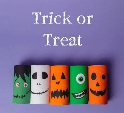 Group of paper tubes with faces on them Stock Photos