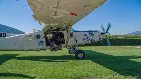 Group of parachuters get inside airplane at aerodrome for next jump. Stock Footage 129252213