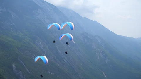 Group of paragliders flying from the mountain Stock Footage 127790772