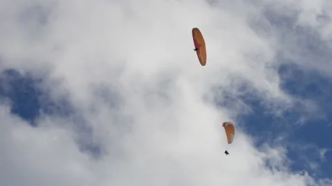 Group of paragliders gliding in the sky Stock Footage 196738342
