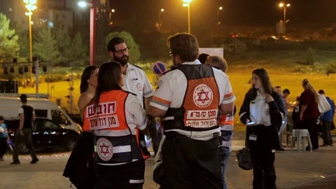 Group of paramedics talking each other during Israel 69th Independence day ce Stock Footage 77767001