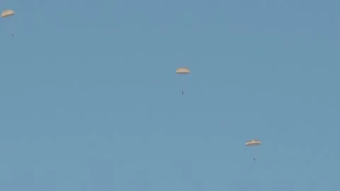 A group of paratroopers leave the plane one by one. Stock Footage 147630080