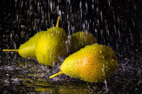 Group of pears with falling water drops Stock Photos