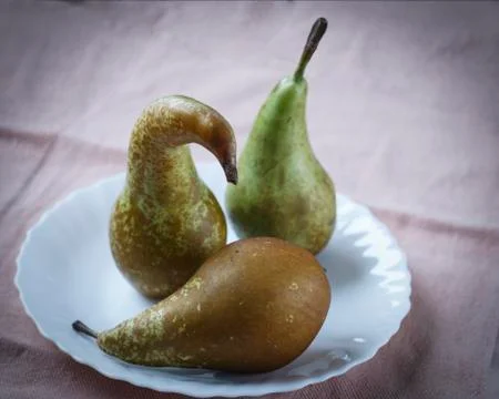 A group of pears on a table Stock Photos