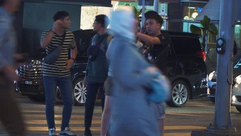 Group of pedestrian crossing street while recording Bukit Bintang video. Stock Footage 113318144