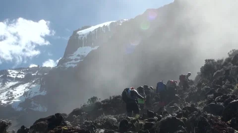 Group of people are climbing to Kilimanjaro (foggy). Tanzania Stock Footage