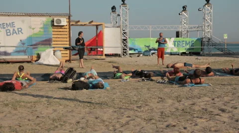 Group of People Are Doing the Plow Pose (Halasana) During a Yoga Class on the Stock Footage 61272333