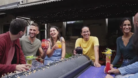 The group of people are having fun and laughing together on the terrace of the Stock Footage 172329832