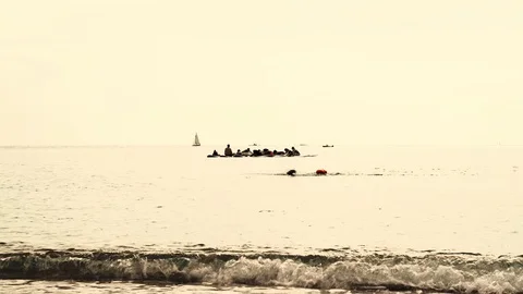A group of people are practicing yoga on the sup boards. Paddle yoga. Stock Footage 121804166