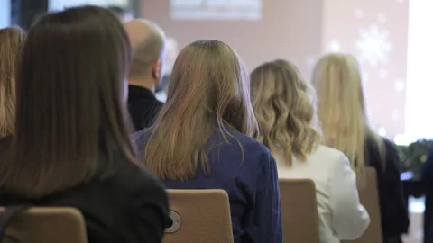 Group of people are sitting in chairs in a room Stock Footage 302260992