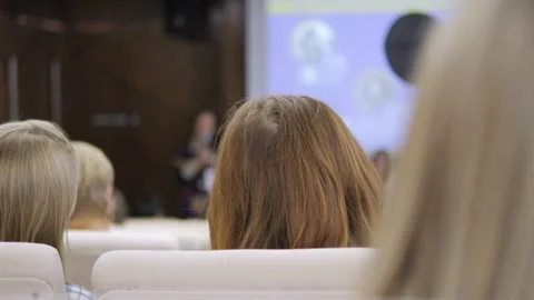 Group of people are sitting in a classroom Stock Footage 310825291