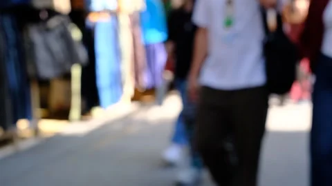 A group of people are walking down a street with a lot of bags and backpacks Stock Footage 295103040