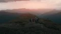 The group of people with backpacks standing on the mountain top 4k or 4k+ Resolution