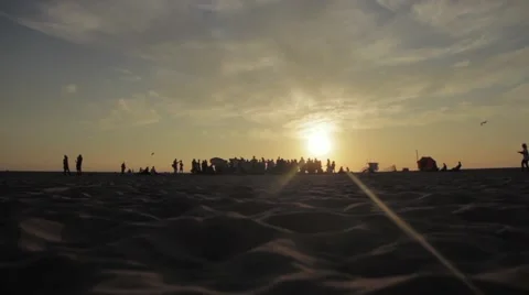 Group of people on the beach at sunset Stock Footage 56343511