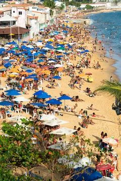 Group of people on Boa Viagem beach in Salvador, Bahia, at critical moment of Stock Photos