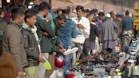 A group of people buying second hand electronic accessories, India  Stock Footage 238763910
