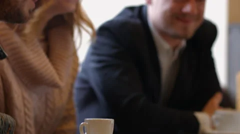 Group of people in the cafe at the table. People talk and drink coffee Video stock 66943418