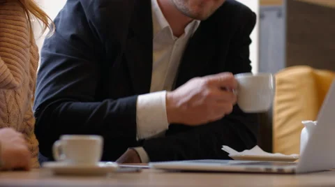 Group of people in the cafe at the table. People talk and drink coffee Video stock 66943449
