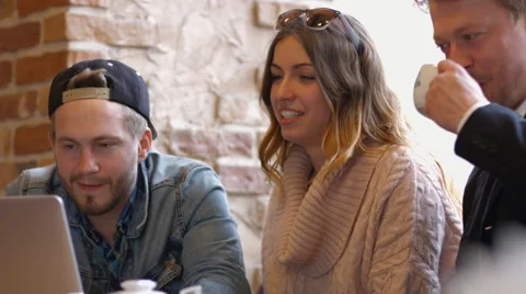 Group of people in the cafe at the table. People talk and drink coffee. Video stock 66945858