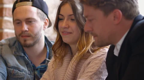 Group of people in the cafe at the table. People talk and drink coffee. Stock Footage 66947254