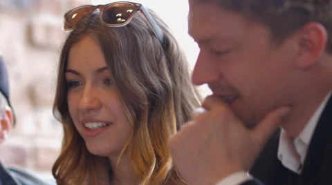 Group of people in the cafe at the table. People talk and drink coffee. Video stock 66955883