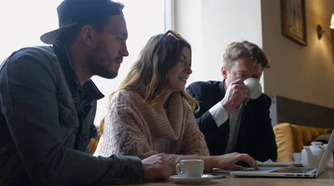 Group of people in the cafe at the table. People talk and drink coffee Stock Footage 66956802
