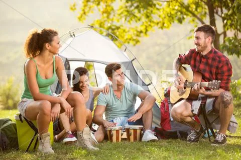 Group Of People Camping And Singing