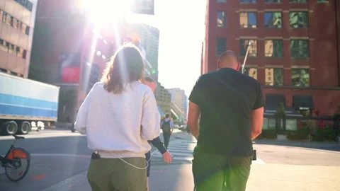 Group of people casually walking along a street in downtown Toronto, surrounded Stock Footage 289452024