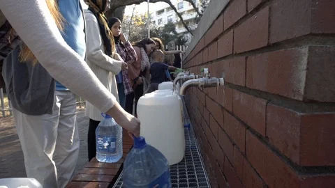 Group of people collecting water during drought in Cape Town Stock Footage 99290553