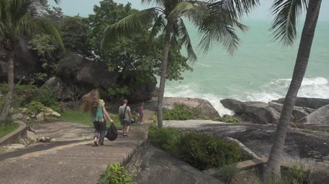 Group of People Coming Down by the Stone Stairs to the Sea. Slow Motion Stock Footage 66199628