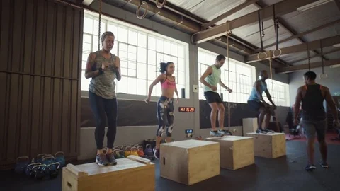 Group of people in crossfit class in gym Stock Footage