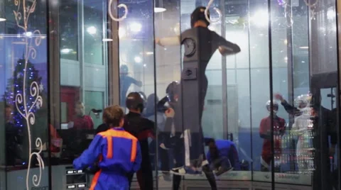 Group of people dance in fly station. Simulator skydiving. Challenge. Audience Stock Footage 67558184
