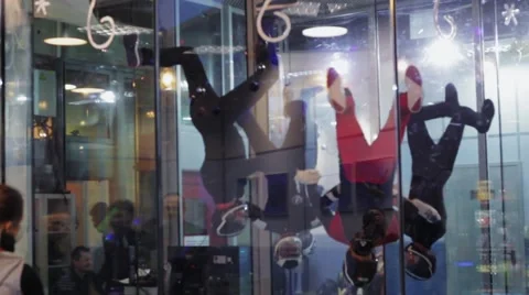 Group of people dance inside fly station. Simulator skydiving. Contest. Team Stock Footage 67558034
