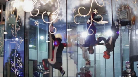 Group of people dance inside fly station. Simulator of skydiving. Contest. Team Stock Footage 67558203