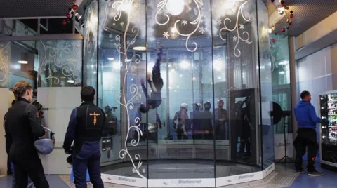 Group of people dance inside fly station. Simulator of skydiving. Challenge Stock Footage 67558216