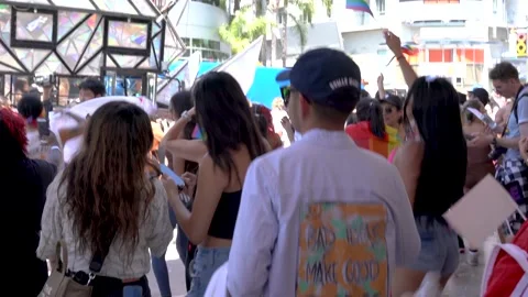 Group of people dancing and jumping to a DJ during the Pride Parade in Hollywood 動画素材 197178035