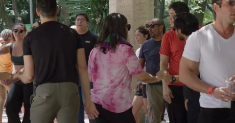 Group of People Dancing Salsa Together Under Shaded Park Pavilion in Mexico City Stock Footage 331777187