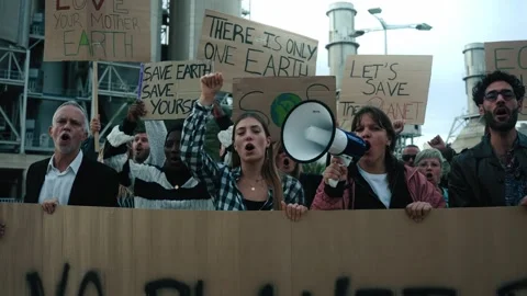 Group of people of different ages and nationalities with arms raised in protest Stock Footage 267485739
