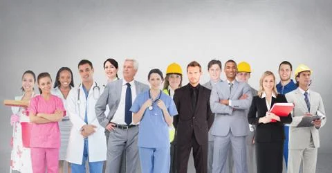 Group of people with different professions standing in front of blank grey 스톡 사진