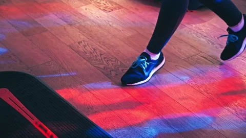 Group of people do aerobics on a step platform to music in the gym Stock Footage 177987758