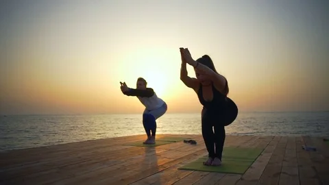Group of people does exercises on the beach slow motion Stock Footage 75570391