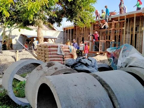 A group of people doing the process of building a house Stock Photos