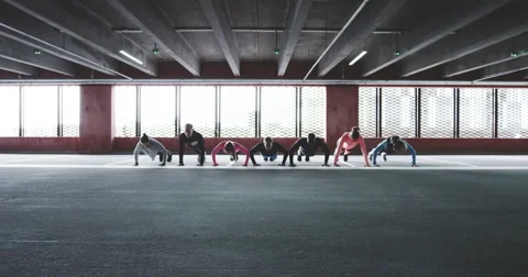Group of people doing push ups and sprint Stock Footage 68814456
