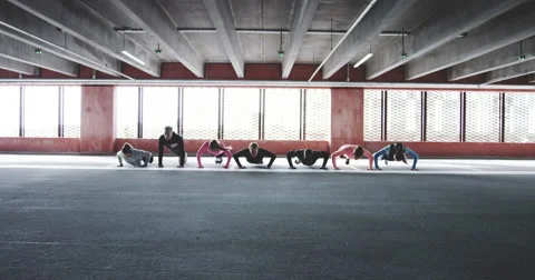 Group of people doing push ups and sprint Stock Footage 68814561
