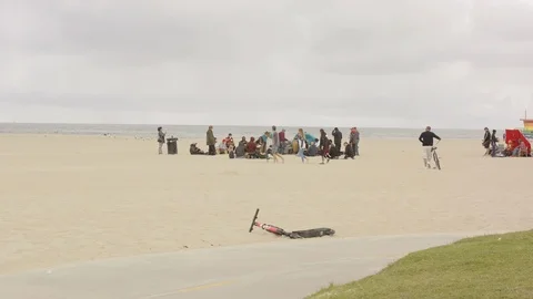 A group of people drumming at the beach Stock Footage 116025054